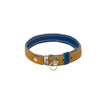 Tan and blue reversible leather cat collar with a magnetic breakaway feature. Showing our simplified and lightweight design with minimal hardware. Blue keeper attached. 