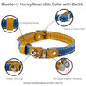 Features of  blue and tan reversible leather cat collar. Shows details on buckle adjustment, the keeper, and the magnetic breakaway feature.