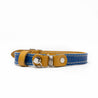 Blue and tan reversible leather cat collar with a magnetic breakaway feature with a buckle adjustment. Showing our simplified and lightweight design with minimal hardware.