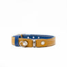 Tan and blue reversible leather cat collar with a magnetic breakaway feature with a buckle adjustment. Showing our simplified and lightweight design with minimal hardware.