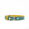 Aqua and yellow reversible leather cat collar with a magnetic breakaway and buckle adjustment. Showing our simplified and lightweight design with minimal hardware.