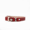 Red and rose reversible leather cat collar with a magnetic breakaway feature. Showing our simplified and lightweight design with minimal hardware.